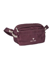 Small maroon waist bag with zippered compartments and VAI-KO logo on the front.
