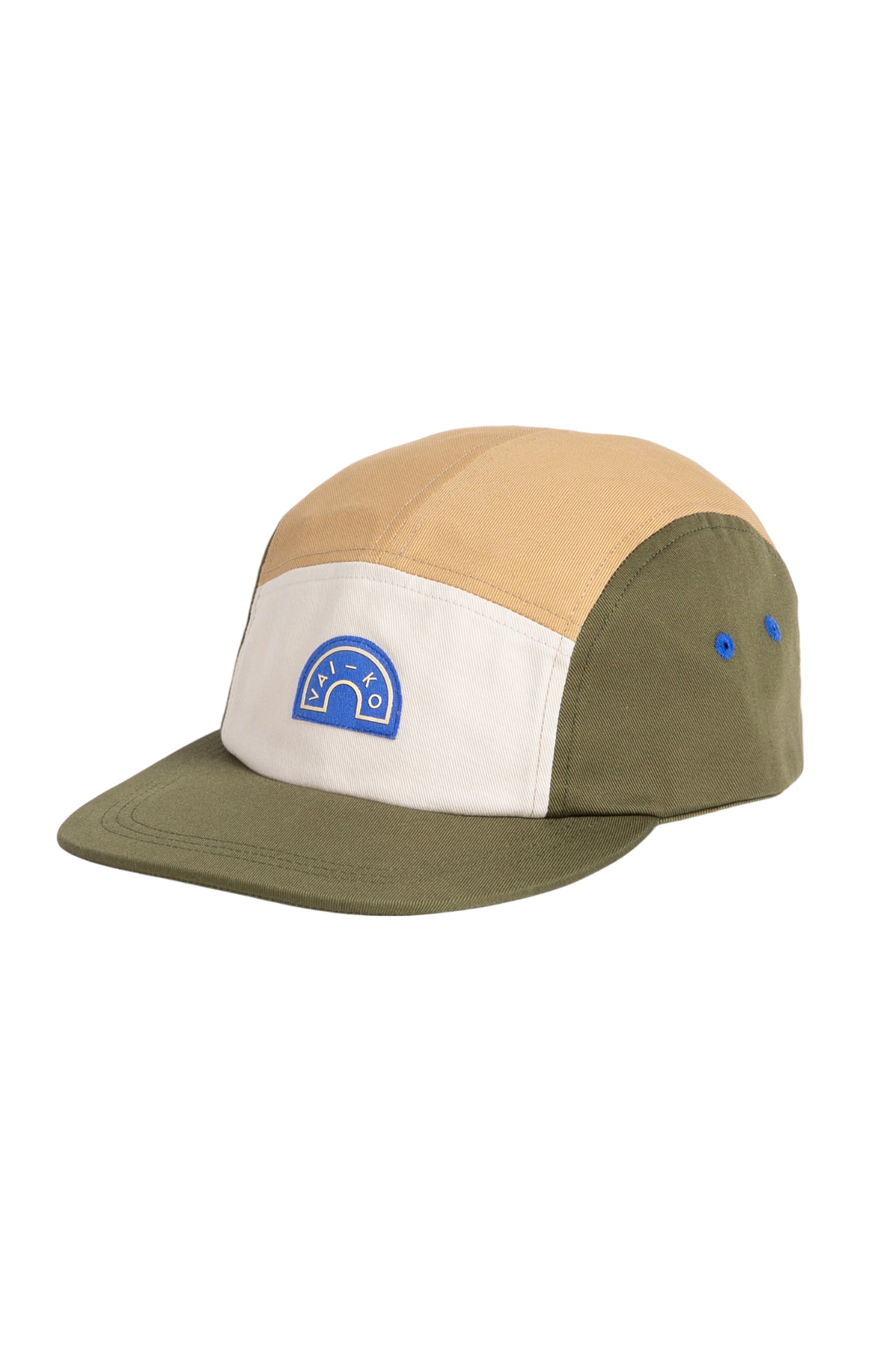 A color-blocked cap with tan, white, and olive panels, blue side eyelets, and a blue embroidered patch on the front.