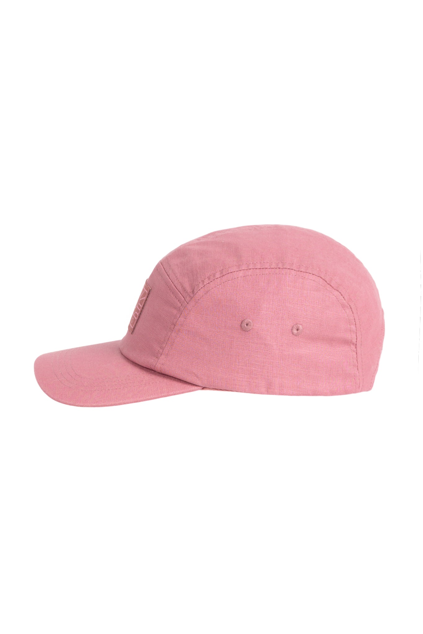 A pink baseball cap with a curved brim and ventilation eyelets, shown from the side on a white background.