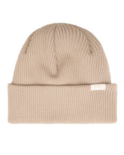 Beige knit beanie with a folded brim and a small white tag on the front.