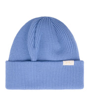 Light blue knit beanie with a folded brim and a small white tag on the brims edge.