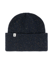 A navy blue ribbed knit beanie with a folded cuff and a small white tag on the front.