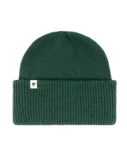 Dark green ribbed knit beanie with a folded brim and a small white tag featuring a black logo.
