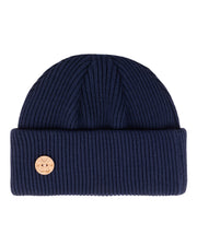 Navy blue ribbed knit beanie with a folded brim and a small round leather patch on the front.