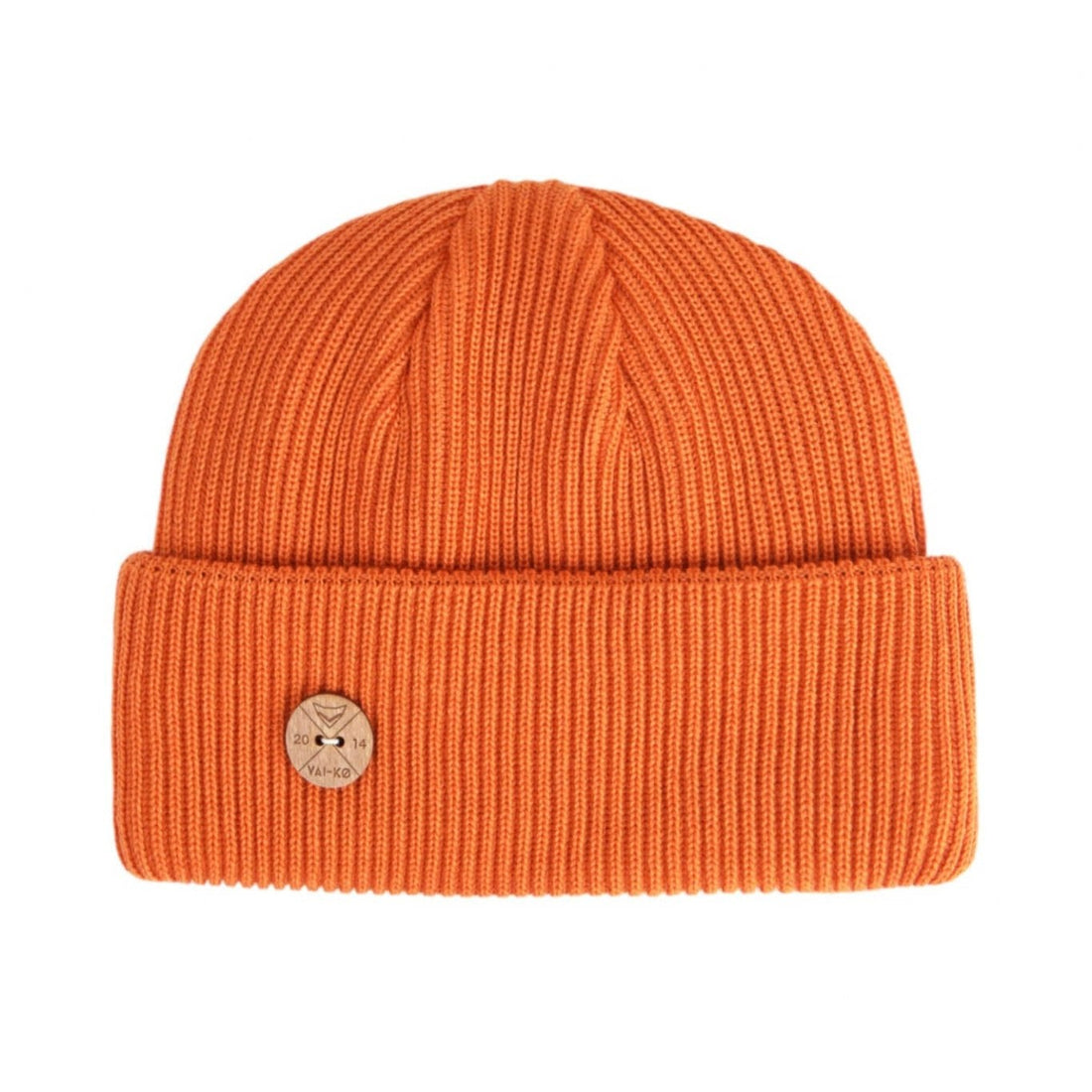 Bright orange ribbed knit beanie with a folded brim and a small round beige patch on the front.